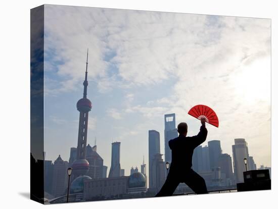 Practising Tai Chi with Fan, and Pudong Skyline, Early Morning, Shanghai, China-Peter Adams-Stretched Canvas