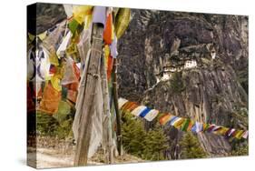 Prayer Flags Along Trail to Takshang Monastery (Tiger's Nest), Bhutan-Howie Garber-Stretched Canvas