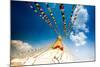 Prayer flags and Buddhist stupa at Bouddha (Boudhanath), UNESCO World Heritage Site, Kathmandu, Nep-Laura Grier-Mounted Photographic Print