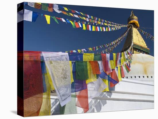 Prayer Flags Flutter from the Apex of Bodnath Stupa, Kathmandu, Nepal-Christopher Bettencourt-Stretched Canvas