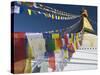 Prayer Flags Flutter from the Apex of Bodnath Stupa, Kathmandu, Nepal-Christopher Bettencourt-Stretched Canvas