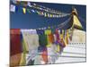 Prayer Flags Flutter from the Apex of Bodnath Stupa, Kathmandu, Nepal-Christopher Bettencourt-Mounted Photographic Print