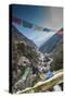 Prayer flags from bridge with Mt. Ama Dablam in background.-Lee Klopfer-Stretched Canvas
