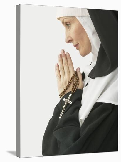 Praying Nun Holding Rosary-null-Stretched Canvas