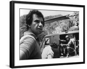 PREDATOR, 1987 directed by JOHN McTIERNAN On the set, the director, John McTiernan (b/w photo)-null-Framed Photo