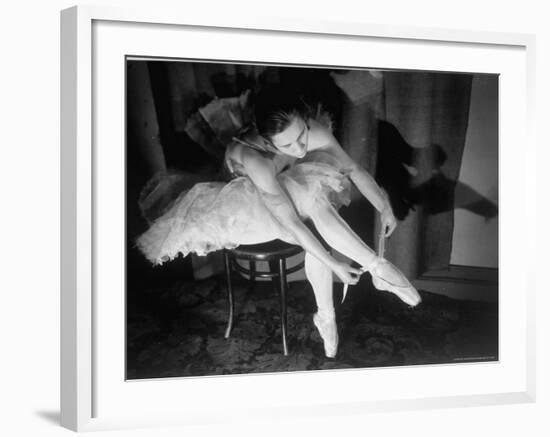 Premier Ballerina Semionova Tying Her Toe Shoe Before a Performance at the Great Theater-Margaret Bourke-White-Framed Photographic Print