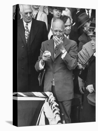 Pres. Dwight D. Eisenhower, Applying a Wet Whammy to First Official Baseball of Washington Season-George Skadding-Stretched Canvas