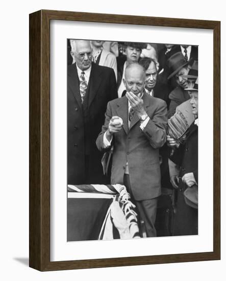 Pres. Dwight D. Eisenhower, Applying a Wet Whammy to First Official Baseball of Washington Season-George Skadding-Framed Photographic Print