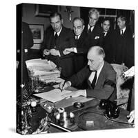 Pres. Franklin D. Roosevelt Signing Declaration of War Following Japanese Bombing of Pearl Harbor-Thomas D^ Mcavoy-Stretched Canvas