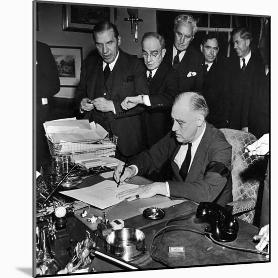 Pres. Franklin D. Roosevelt Signing Declaration of War Following Japanese Bombing of Pearl Harbor-Thomas D^ Mcavoy-Mounted Photographic Print