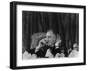 Pres. Franklin Roosevelt Drinking Wine and Smoking a Cigarette During the Jackson Day Dinner-null-Framed Photographic Print