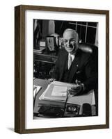 Pres. Harry S. Truman Seated at His Desk in the White House, Family Photographs on Table Behind Him-Gjon Mili-Framed Photographic Print