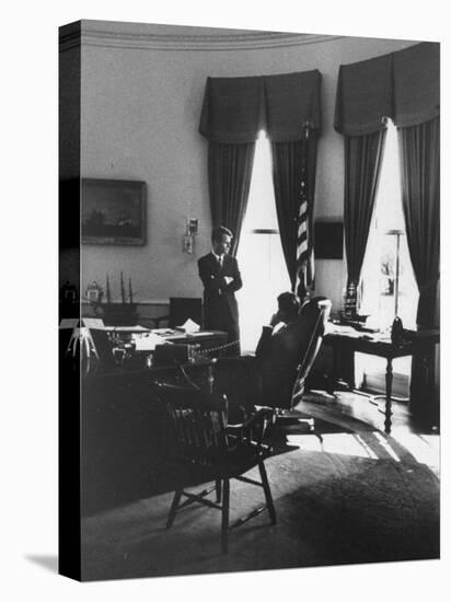 Pres. John F. Kennedy and Attorney Gen. Robert F. Kennedy Conferring in the Oval Office-null-Stretched Canvas