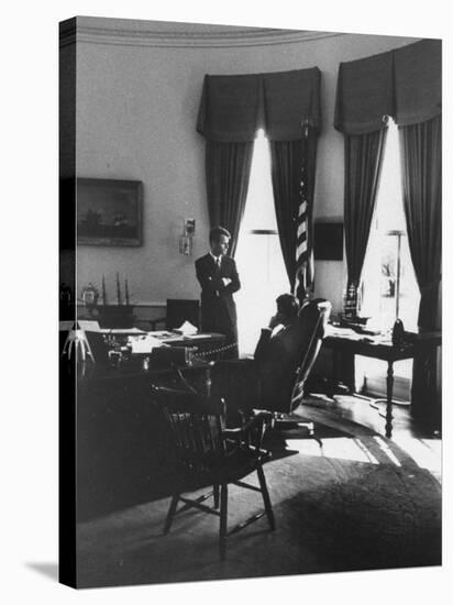 Pres. John F. Kennedy and Attorney Gen. Robert F. Kennedy Conferring in the Oval Office-null-Stretched Canvas