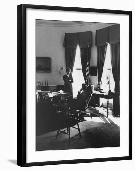 Pres. John F. Kennedy and Attorney Gen. Robert F. Kennedy Conferring in the Oval Office-null-Framed Photographic Print