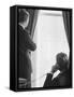 Pres. John F. Kennedy on Telephone While Brother, Attorney General Robert F. Kennedy Stands Nearby-Art Rickerby-Framed Stretched Canvas