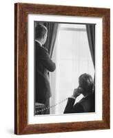 Pres. John F. Kennedy on Telephone While Brother, Attorney General Robert F. Kennedy Stands Nearby-Art Rickerby-Framed Photographic Print