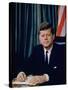 Pres. John F. Kennedy Sitting at His Desk, with Flag in Bkgrd-Alfred Eisenstaedt-Stretched Canvas