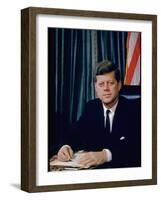 Pres. John F. Kennedy Sitting at His Desk, with Flag in Bkgrd-Alfred Eisenstaedt-Framed Premium Photographic Print