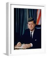 Pres. John F. Kennedy Sitting at His Desk, with Flag in Bkgrd-Alfred Eisenstaedt-Framed Premium Photographic Print