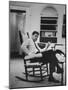 Pres. John F. Kennedy Sitting in Rocking Chair-null-Mounted Photographic Print