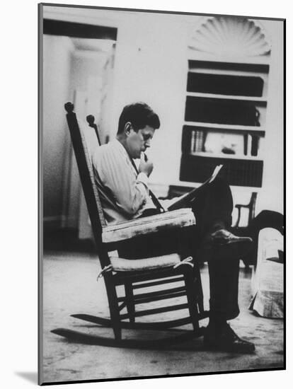 Pres. John F. Kennedy Sitting in Rocking Chair-null-Mounted Photographic Print