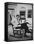 Pres. John F. Kennedy Sitting in Rocking Chair-null-Framed Stretched Canvas