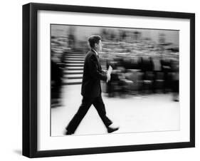Pres John Kennedy Walking Fast after Press Conference in State Department Auditorium, Mar 11, 1963-null-Framed Photo
