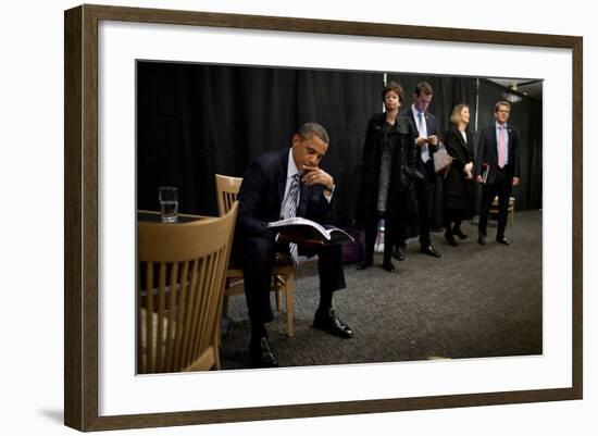 President Barack Obama Reviews Notes as His Staff Waits before an Event in Denver, Colorado-null-Framed Photo