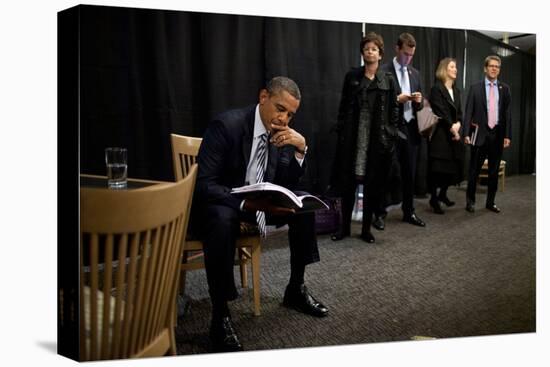 President Barack Obama Reviews Notes as His Staff Waits before an Event in Denver, Colorado-null-Stretched Canvas