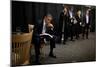 President Barack Obama Reviews Notes as His Staff Waits before an Event in Denver, Colorado-null-Mounted Premium Photographic Print