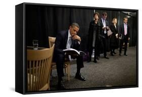 President Barack Obama Reviews Notes as His Staff Waits before an Event in Denver, Colorado-null-Framed Stretched Canvas