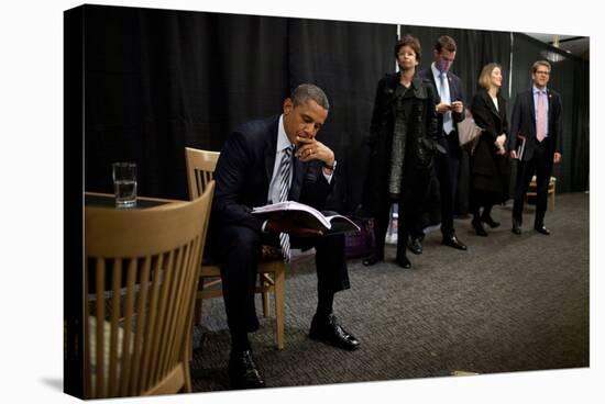 President Barack Obama Reviews Notes as His Staff Waits before an Event in Denver, Colorado-null-Stretched Canvas