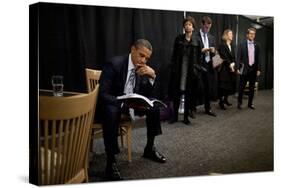 President Barack Obama Reviews Notes as His Staff Waits before an Event in Denver, Colorado-null-Stretched Canvas