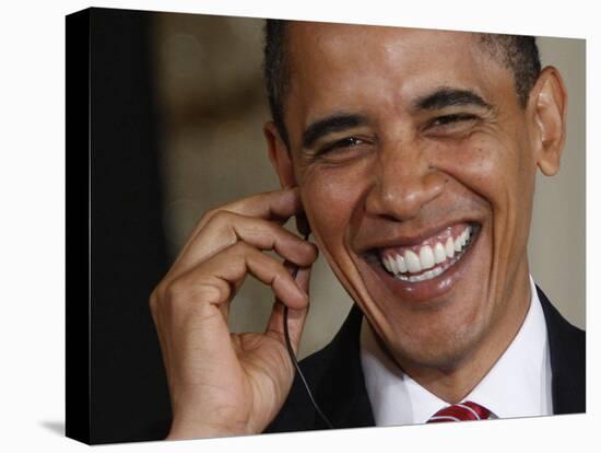 President Barack Obama Smiles as He Participates in a Joint News Conference in the White House-null-Stretched Canvas