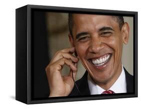 President Barack Obama Smiles as He Participates in a Joint News Conference in the White House-null-Framed Stretched Canvas