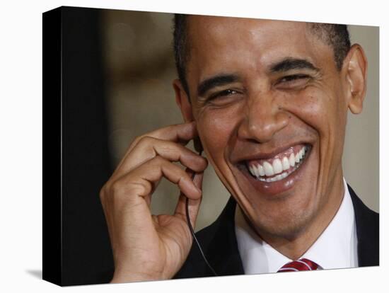 President Barack Obama Smiles as He Participates in a Joint News Conference in the White House-null-Stretched Canvas