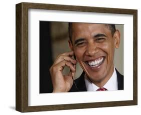 President Barack Obama Smiles as He Participates in a Joint News Conference in the White House-null-Framed Photographic Print