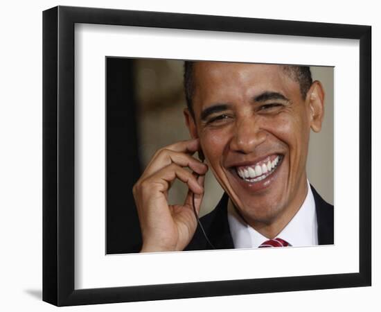 President Barack Obama Smiles as He Participates in a Joint News Conference in the White House-null-Framed Photographic Print