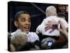 President Barack Obama Smiles at a Baby During His Event at the University of Iowa in Iowa City-null-Stretched Canvas