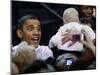 President Barack Obama Smiles at a Baby During His Event at the University of Iowa in Iowa City-null-Mounted Photographic Print