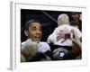 President Barack Obama Smiles at a Baby During His Event at the University of Iowa in Iowa City-null-Framed Photographic Print