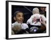 President Barack Obama Smiles at a Baby During His Event at the University of Iowa in Iowa City-null-Framed Photographic Print