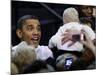 President Barack Obama Smiles at a Baby During His Event at the University of Iowa in Iowa City-null-Mounted Photographic Print