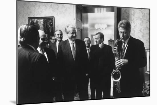 President Bill Clinton Plays the Saxophone Presented to Him by Russian President Boris Yeltsin-null-Mounted Premium Photographic Print