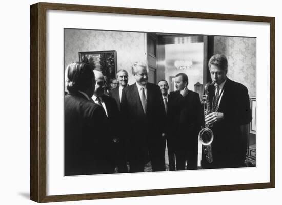 President Bill Clinton Plays the Saxophone Presented to Him by Russian President Boris Yeltsin-null-Framed Photo