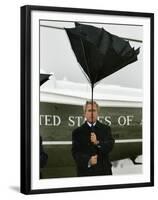 President Bush Jokingly Holds His Wind-Blown Umbrella Upright-null-Framed Premium Photographic Print