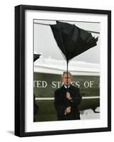 President Bush Jokingly Holds His Wind-Blown Umbrella Upright-null-Framed Photographic Print