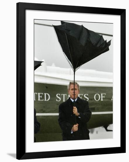 President Bush Jokingly Holds His Wind-Blown Umbrella Upright-null-Framed Photographic Print