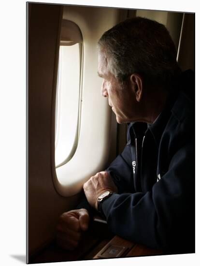 President Bush Looks out the Window of Air Force One Over New Orleans-null-Mounted Premium Photographic Print